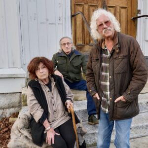 Alice Brock, Arlo Guthrie, and their friend Rick Robbins reunited at the old church in Great Barrington, now The Guthrie Center, where the 1965 Thanksgiving dinner that inspired Guthrie’s song took place, for Thanksgiving in 2022.