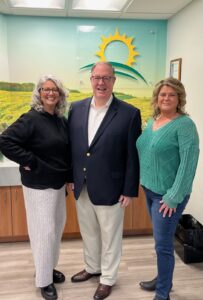 Homefield Credit Union’s President Karl Moisan, center, standing here with Lisa Kelley of the Grafton Senior Center and Lori Houlden-Girard of Meals That Matter, has supported both organizations with generous financial donations.